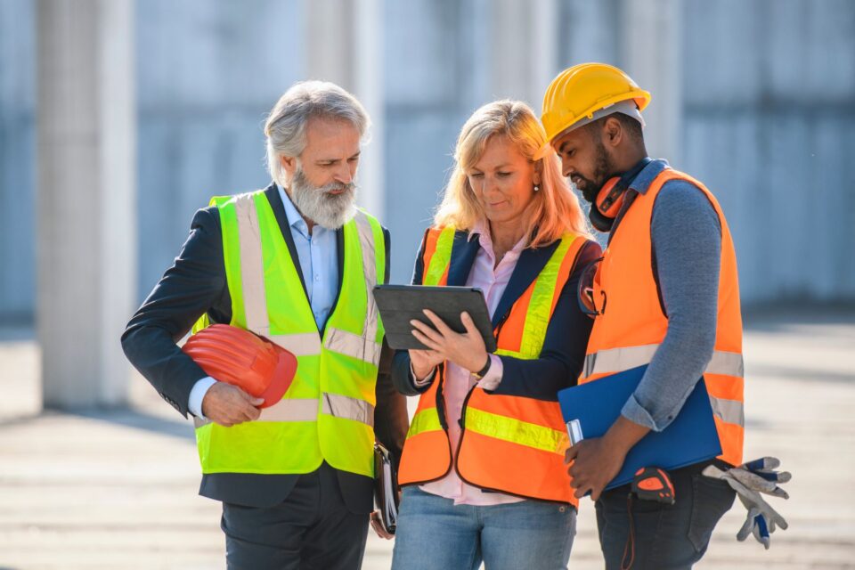 project managers looking at their construction bidding process