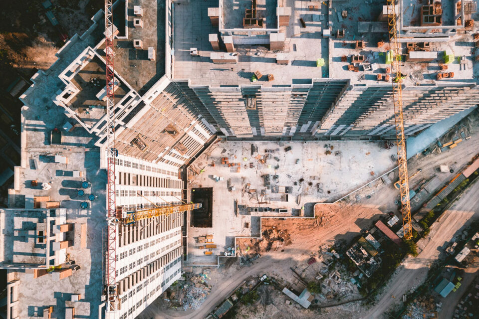 looking at a large construction site with a crane